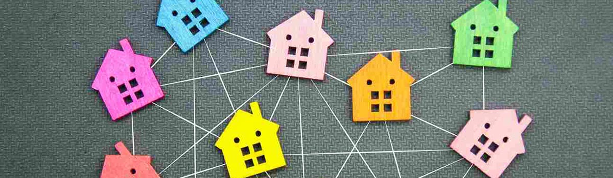 Cutouts of houses connected by white lines.