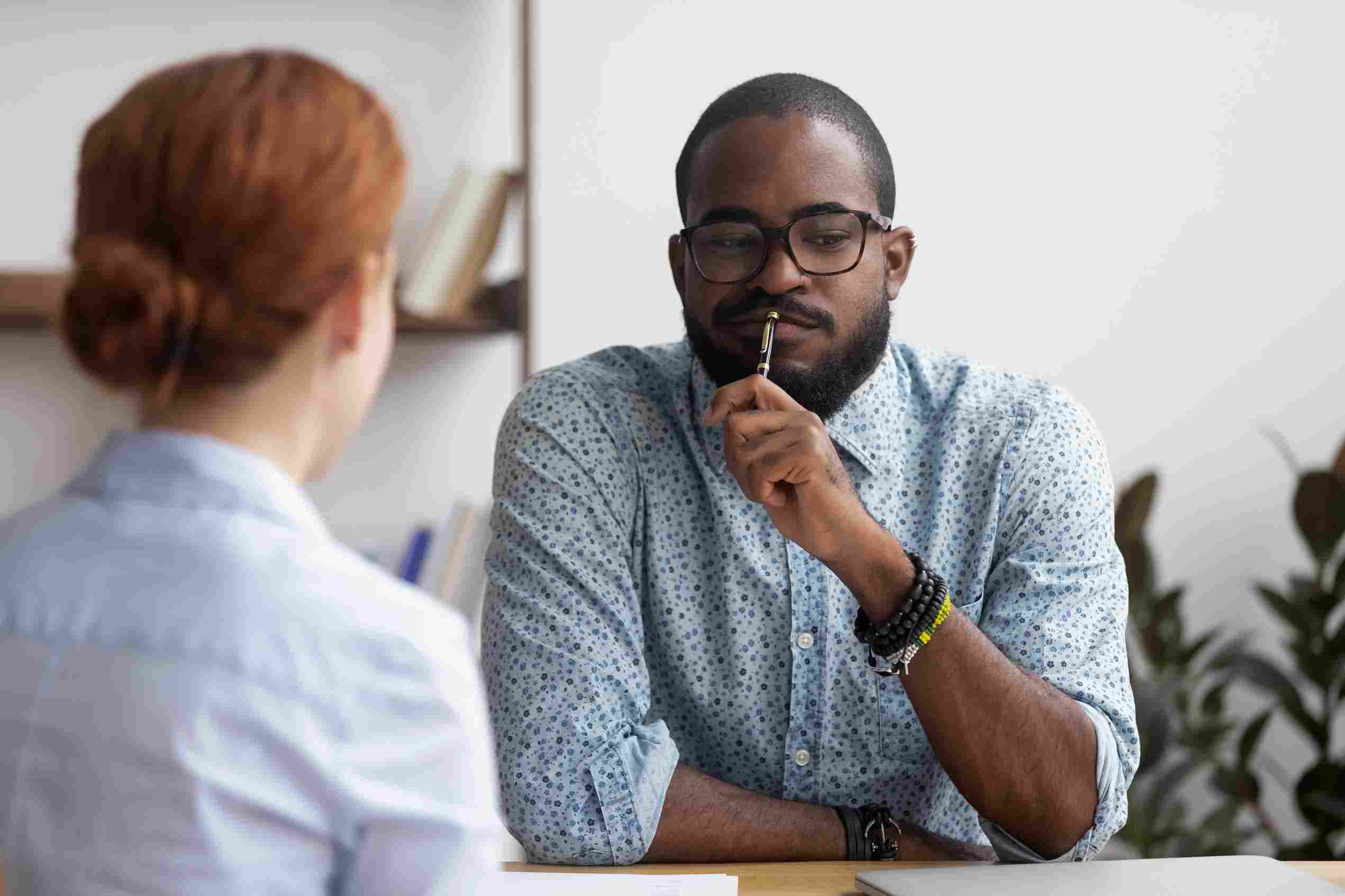 Male employer interviewing a female job applicant.